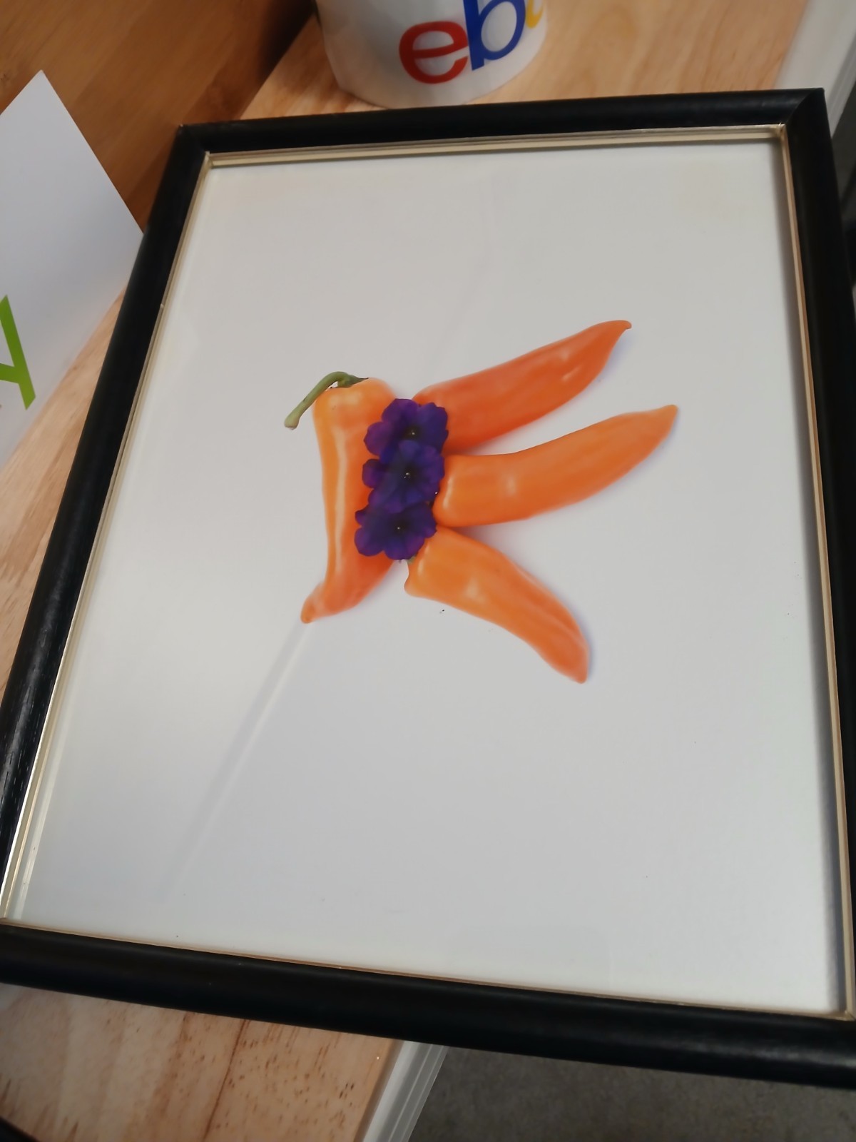 black framed photo art 12 x 9 inches 4 orange peppers with 3 purple flowers