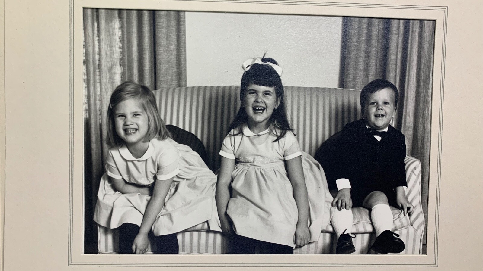 Portrait Of Three Children Laughing. Unknown.