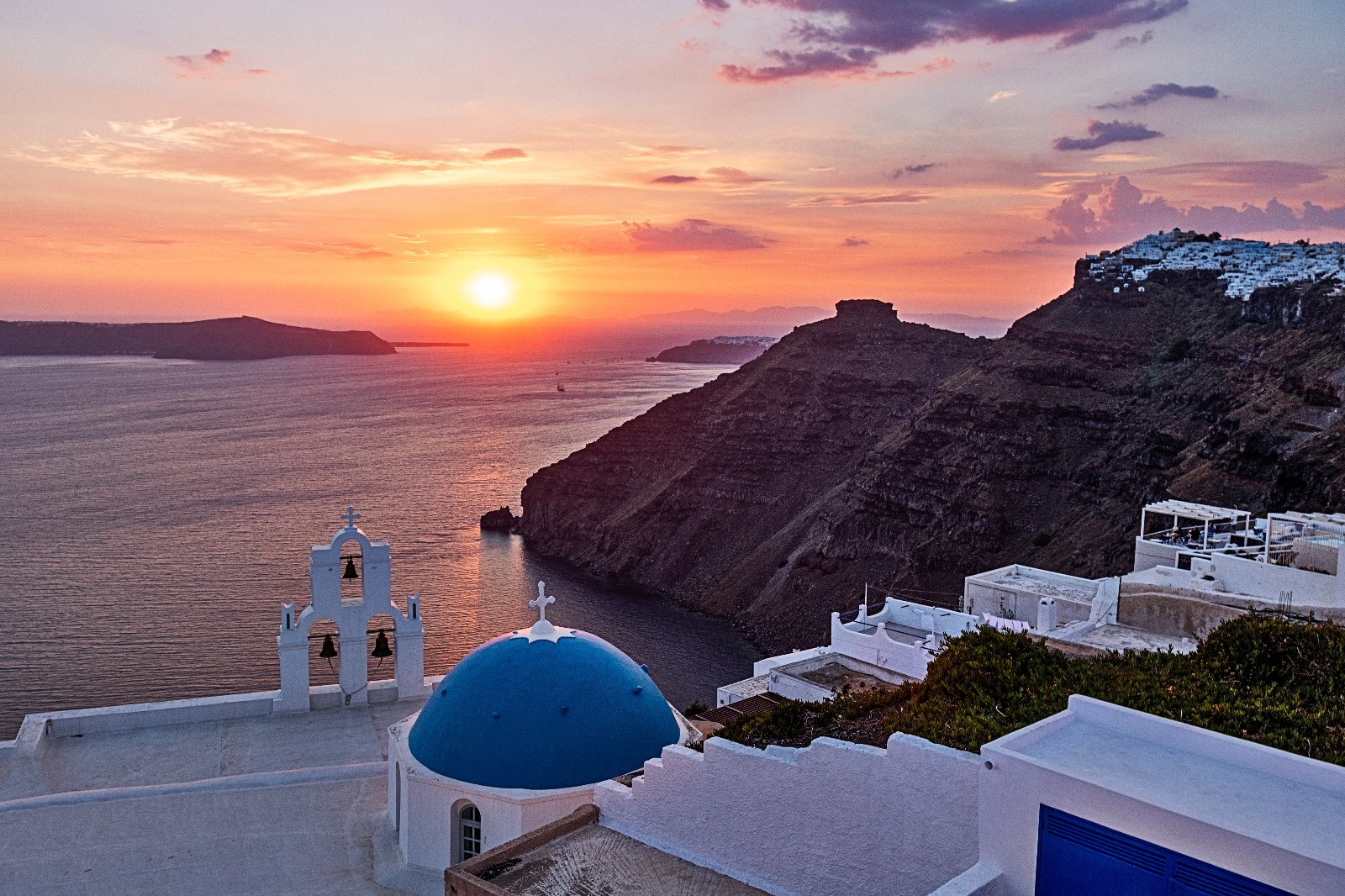 Bells of Thira sunset over santorini, Greece like Rick steves travel