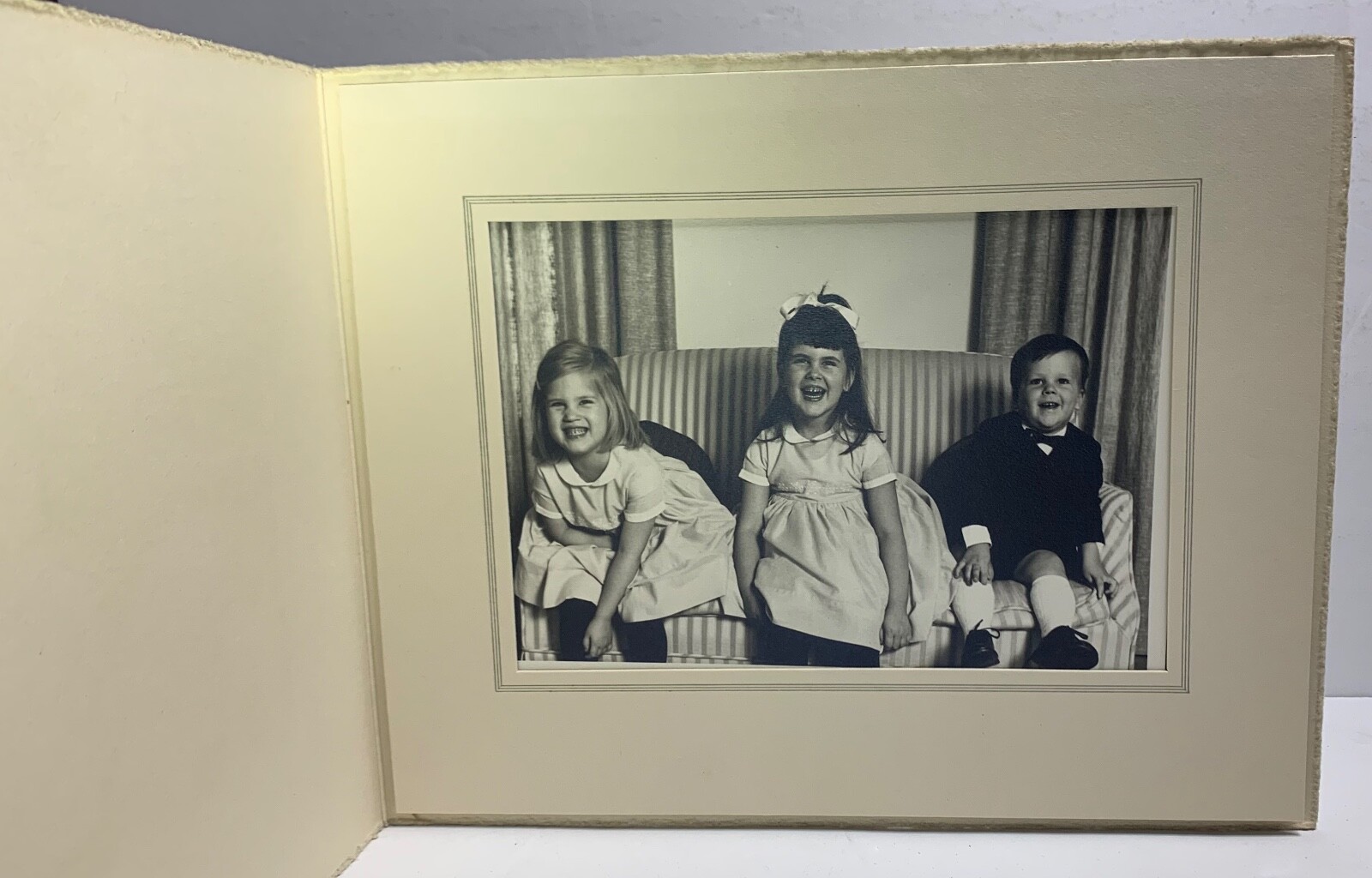 Portrait Of Three Children Laughing. Unknown.