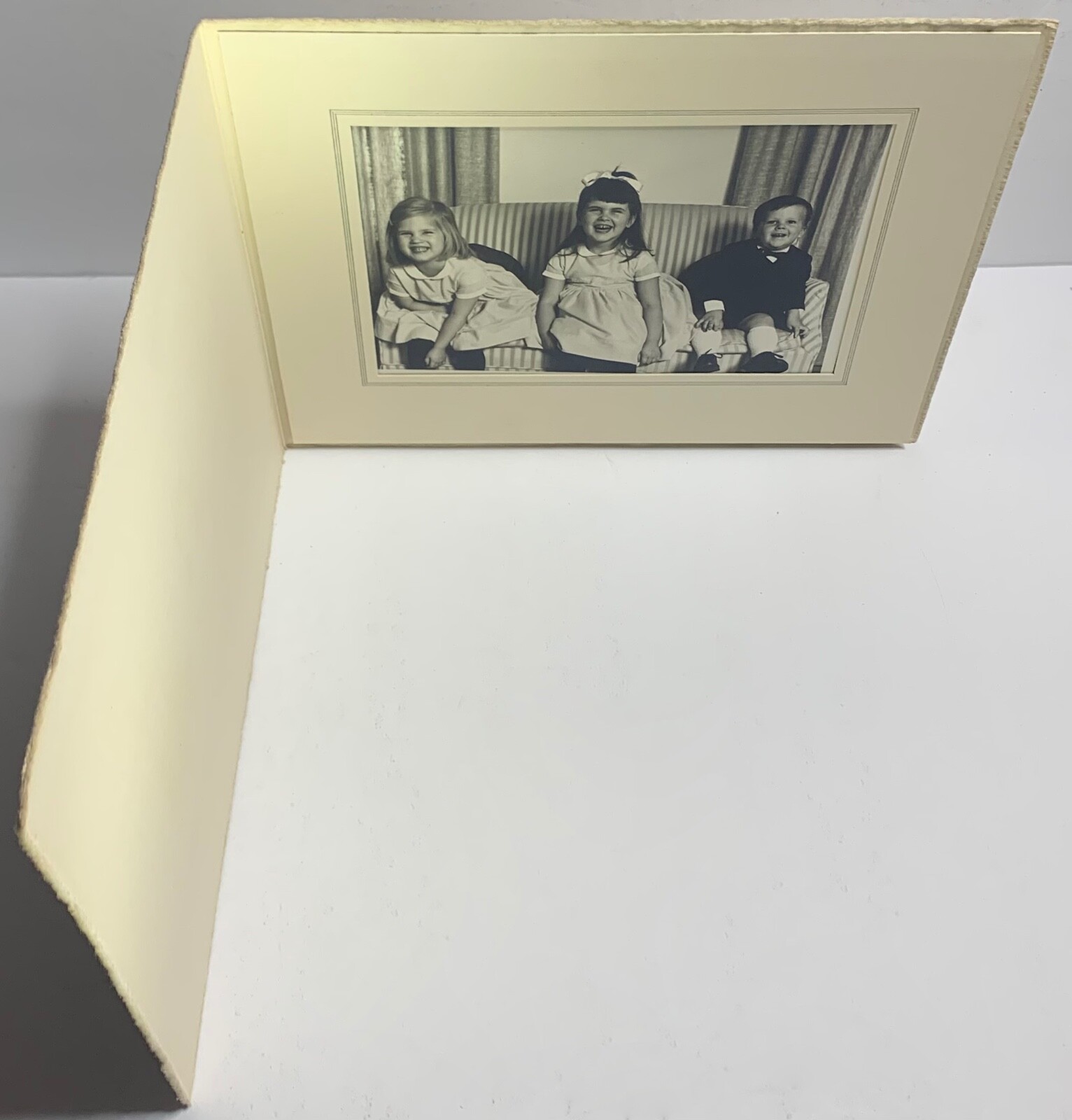 Portrait Of Three Children Laughing. Unknown.