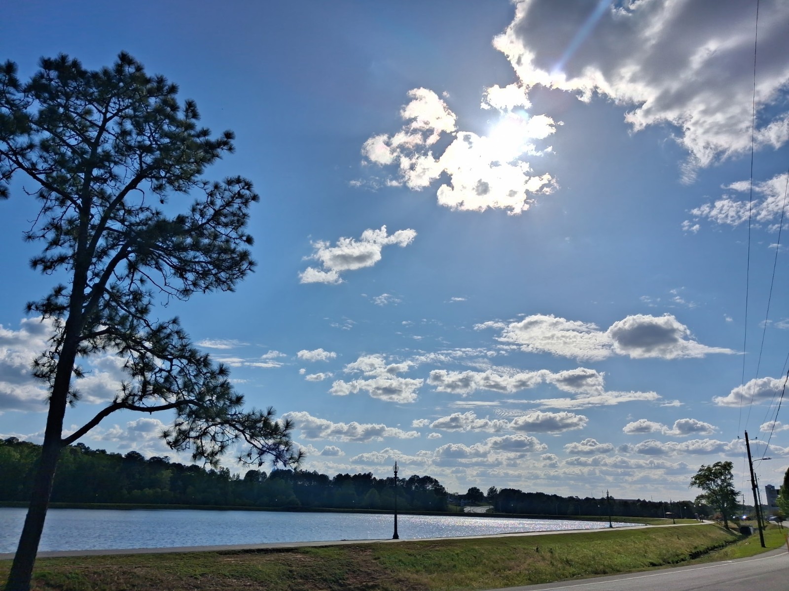 Color Sunset Landscape Photograph – Road by Lake With Trees & Sky