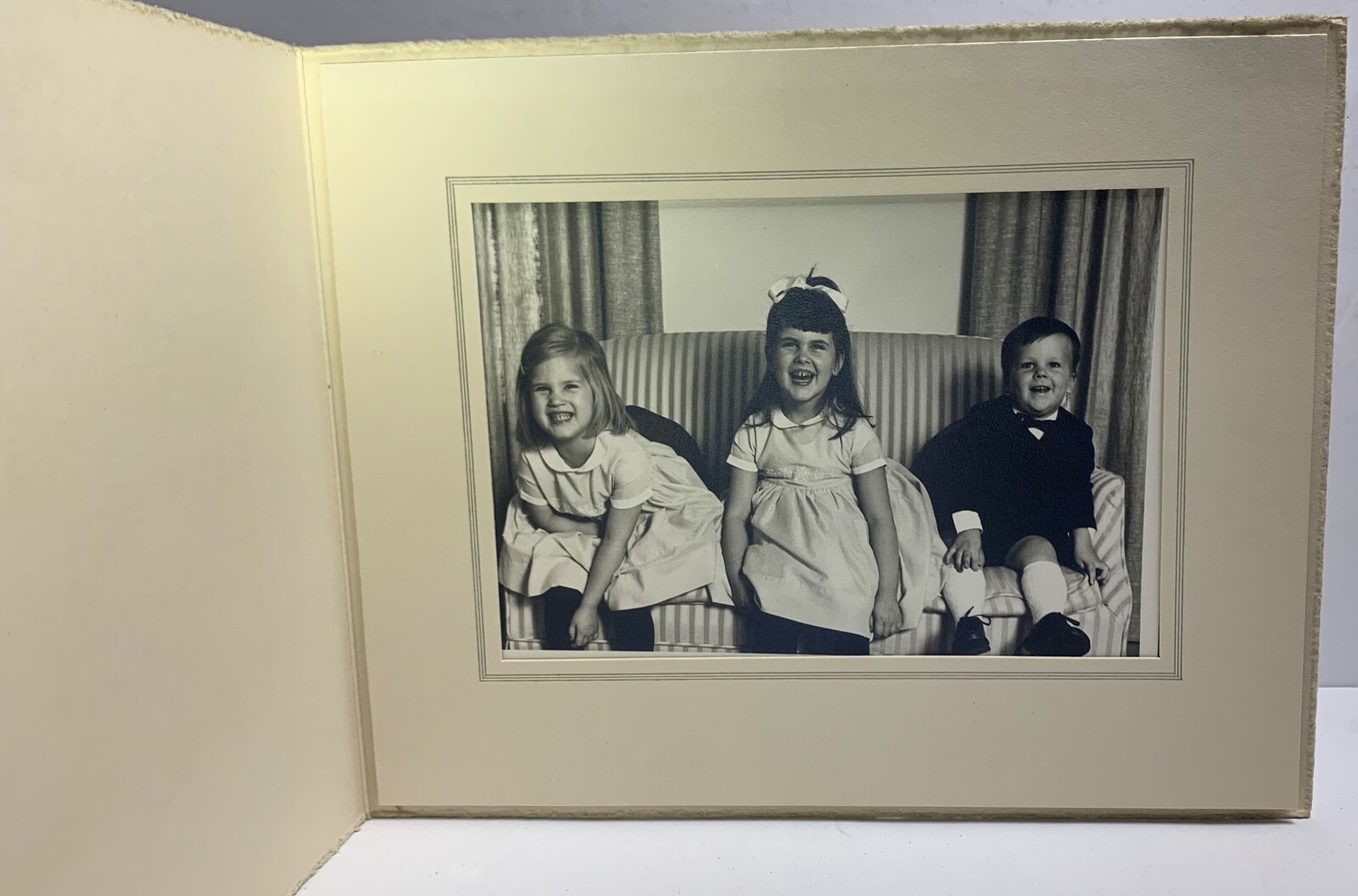 Portrait Of Three Children Laughing. Unknown.
