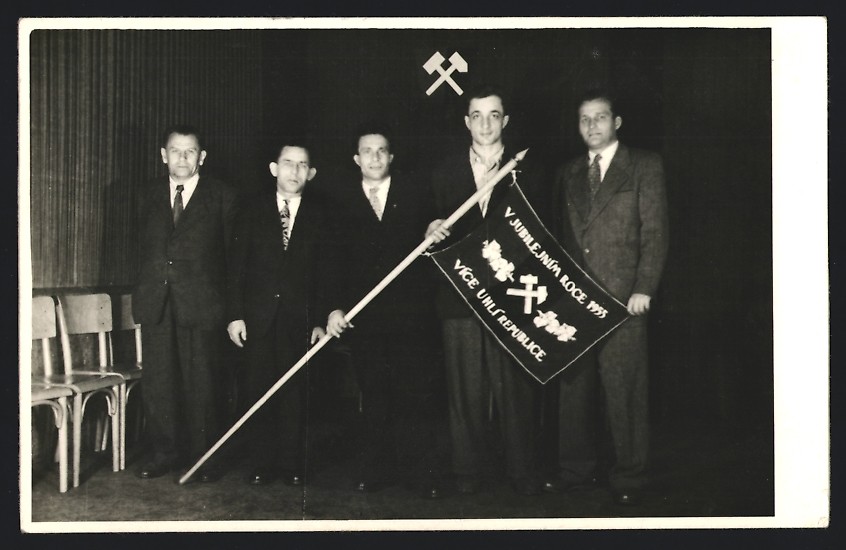 Photograph: Miners with standard celebrate 50th anniversary