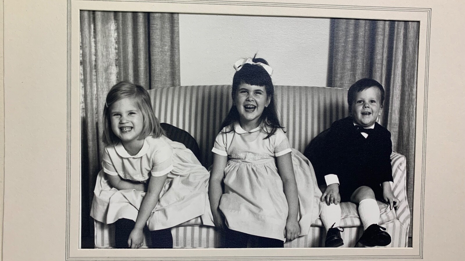 Portrait Of Three Children Laughing. Unknown.