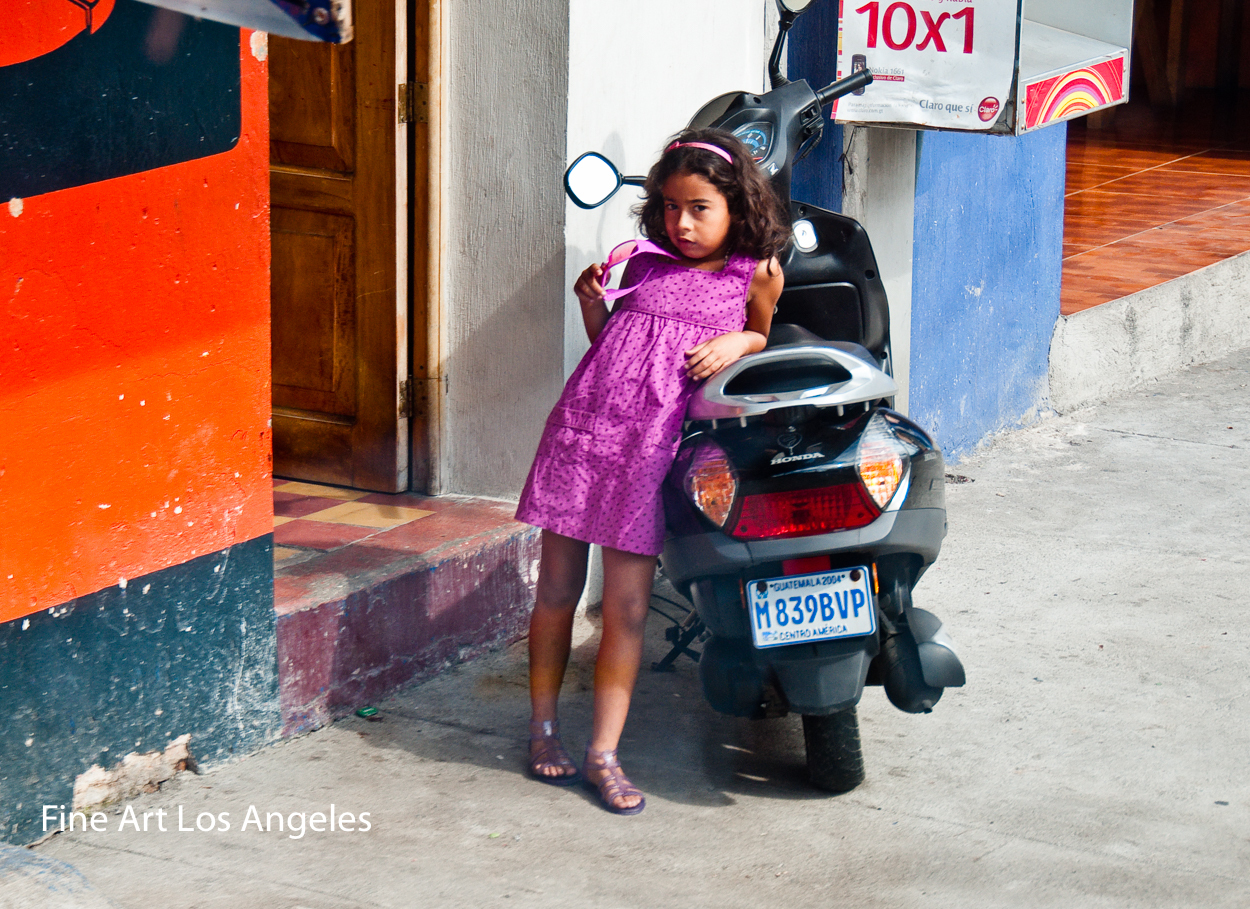 Neil Reichline Photo, “Girl with Motorcycle” Quatemala